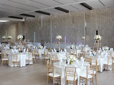 groups of tables set for wedding dinner