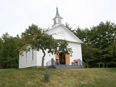 white church on top of small hill