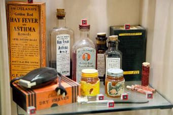 medicine cabinet exhibit with bottles and containers