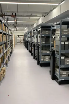 room full of racks of files and boxes