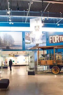 wide view of museum gallery with single person viewing