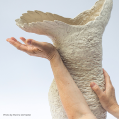 arm beside sculpture