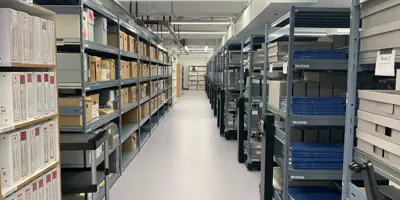 room full of racks of files and boxes